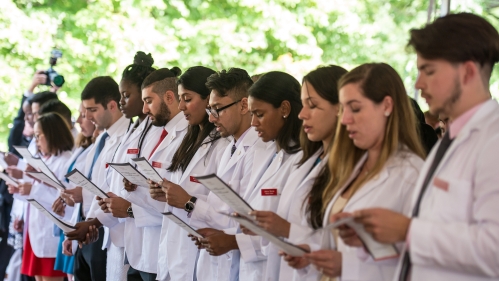 Incoming NJMS students take the oath at the white coat ceremony