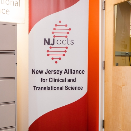 A sign shows the New Jersey Alliance for Clinical and Translational Science logo